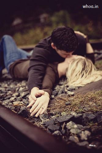 Couple Kiss Railway Track Wallpaper For Mobile