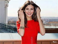 victoria justice giving smiling pose in red dress