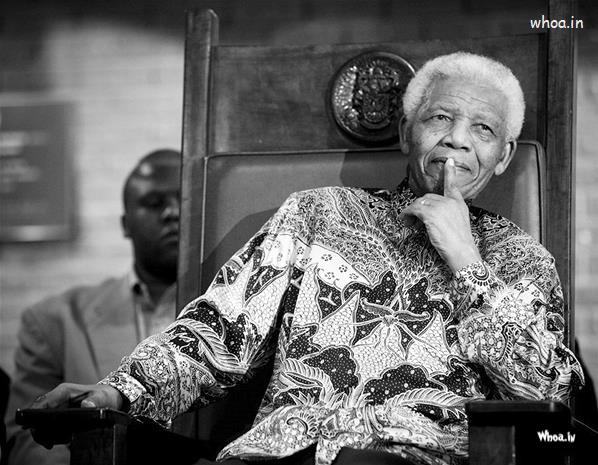 Nelson Mandela Sitting On A Chair