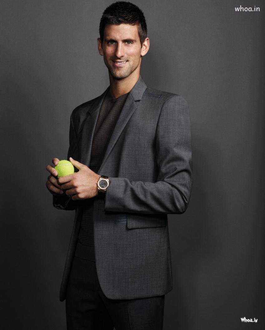 Novak Djokovic In  Black Suit With Tennis Ball
