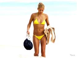 anna kournikova in yellow bikini on a beach