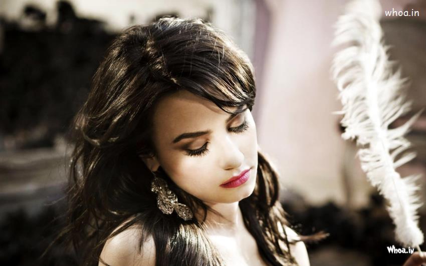 Demi Lovato Sad Face With White Feather