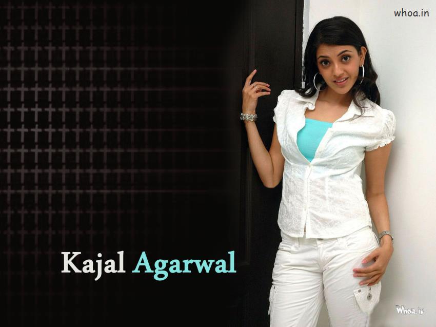 Kajal Agarwal In White Top And White Pant With Naughty Smile