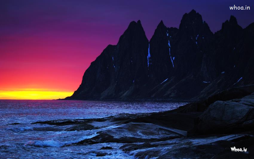 Amazing Natural Sunset Eith Sea And Black Mountain