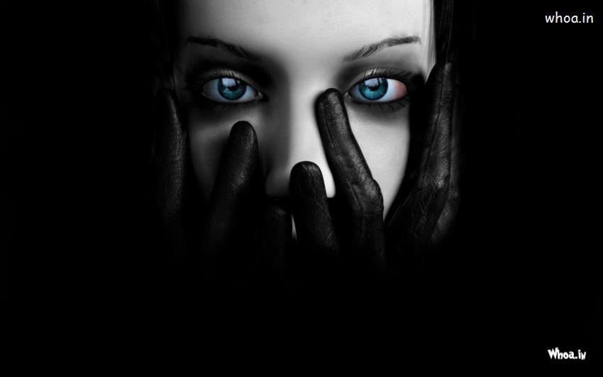Blue Eyed Girl In Dark Background Wallpaper