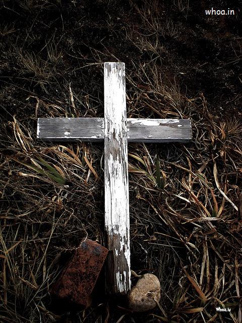 Christian Cross Lying On Ground