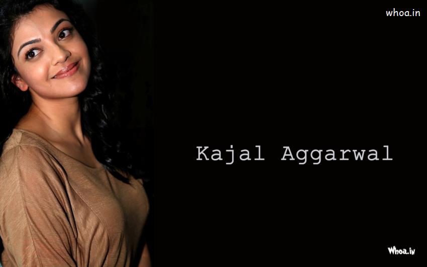 Kajal Aggarwal With Gry Top And Dark Background Wallpaper
