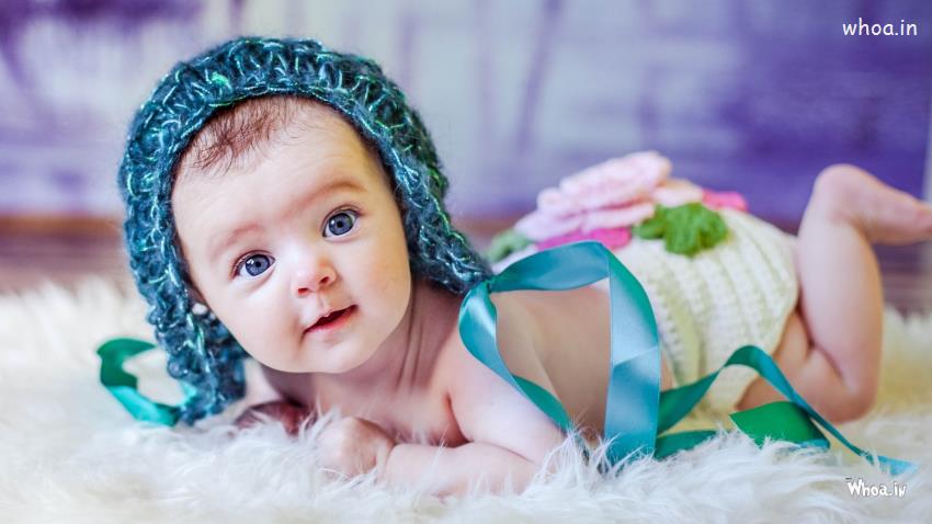Newborn Blue Baby Knitted Hat With Face Closeup HD Newborn Wallpaper