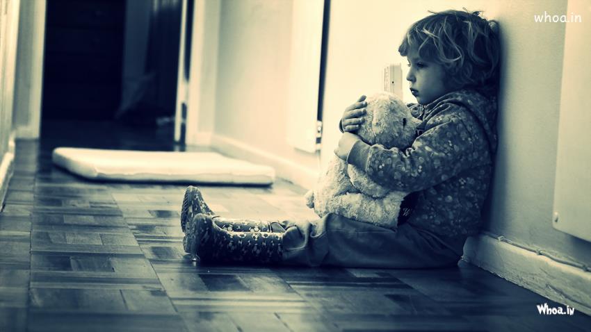 Sad Boy Is Leaning Back On Wall With Teddytoy Image Download