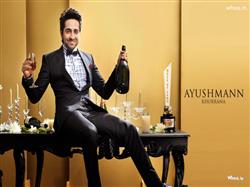 ayushman khurana with champagne in black suit