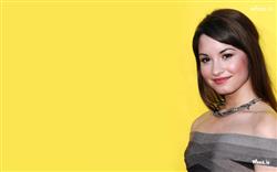 beautiful demi lovato smiling wallpaper with yellow background