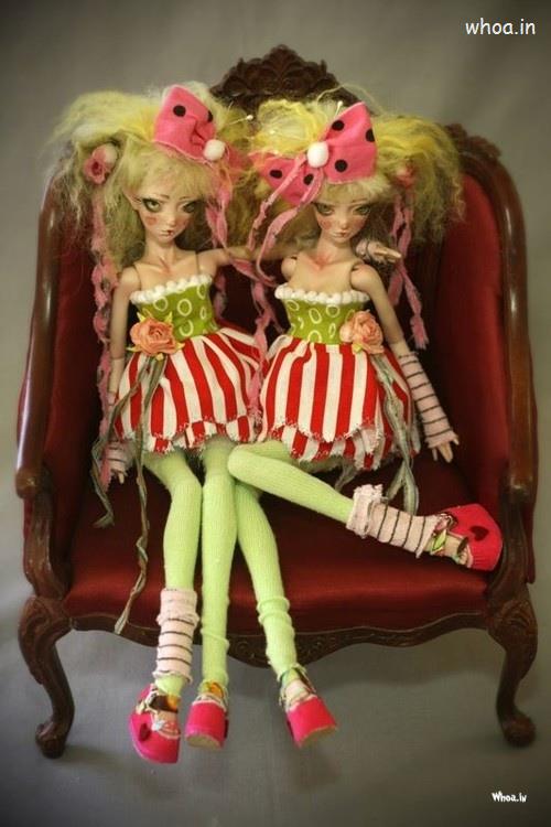 Barbie Doll Twins Sitting On A Chair