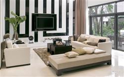 Black and White Wall with a White Branded Sofa
