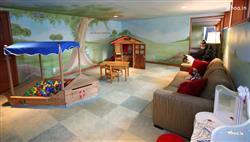 Kids Room With Magical Hillside Wall Decor with Wooden Home Shaped Drawing