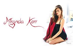 Miranda Kerr Sitting on Bed