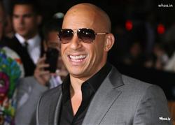 Vin Diesel Smiley Face with Brown Suit Wallpaper