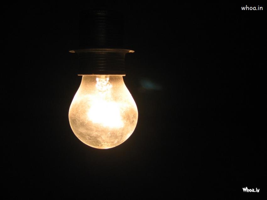 Glowing Bulb In Dark Background Wallpaper