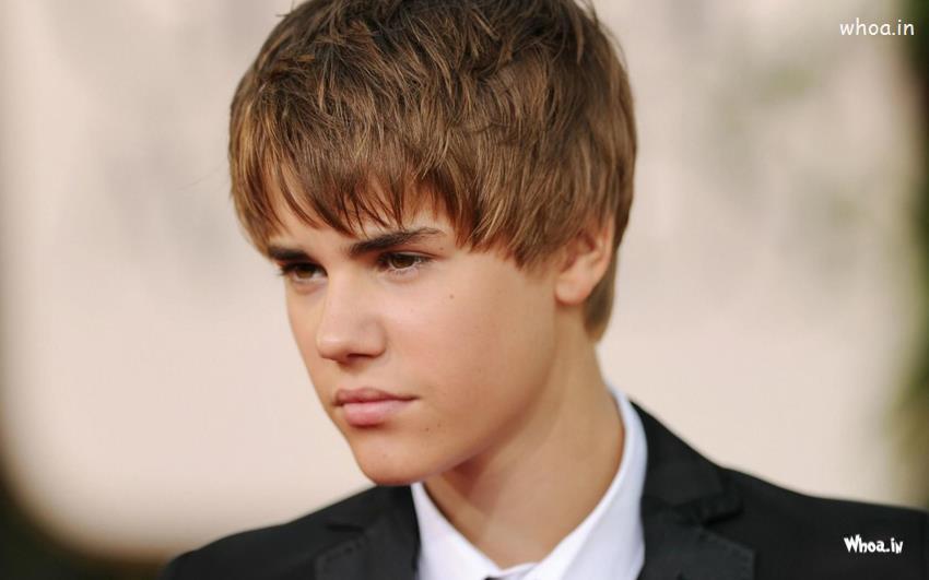 Justin Bieber Brown Hair Style With Face Closeup Wallpaper