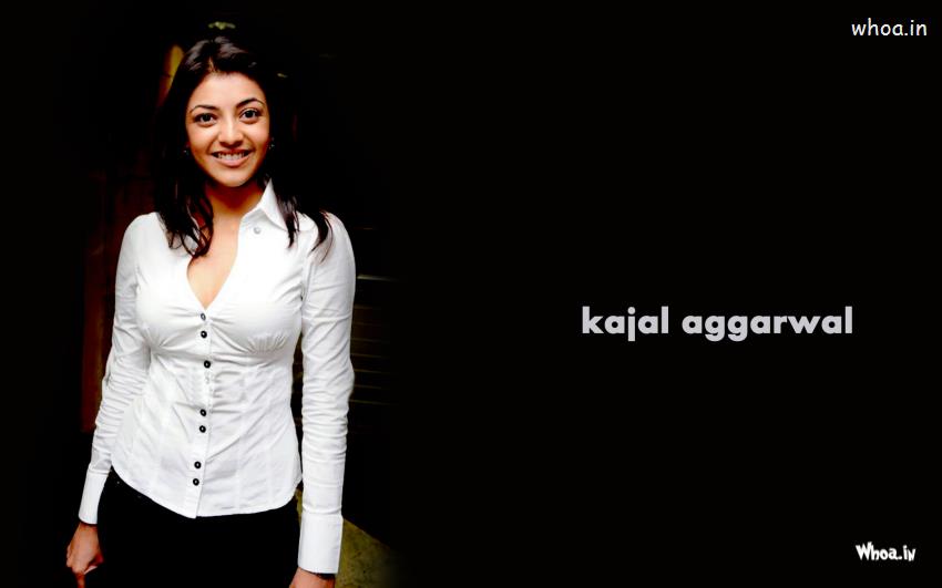 Kajal Aggarwal With White Top And Dark Background Wallpaper