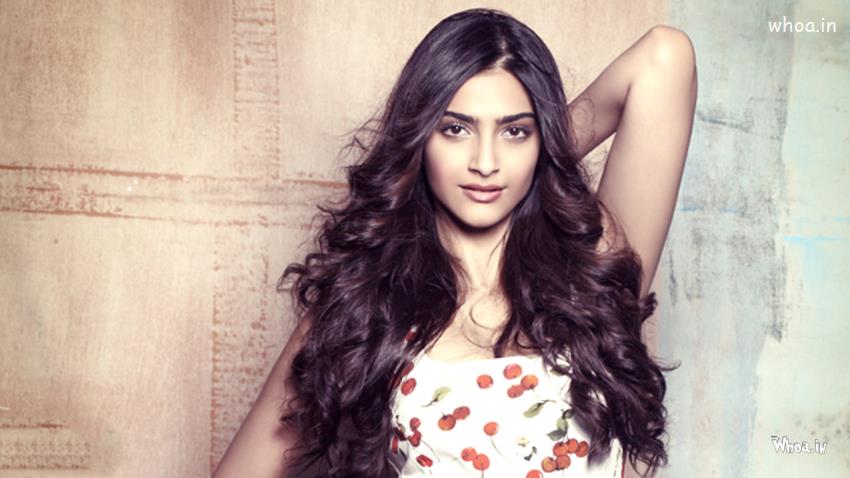 Sonam Kapoor White Top With Naughty Smile Face Closeup Wallpaper