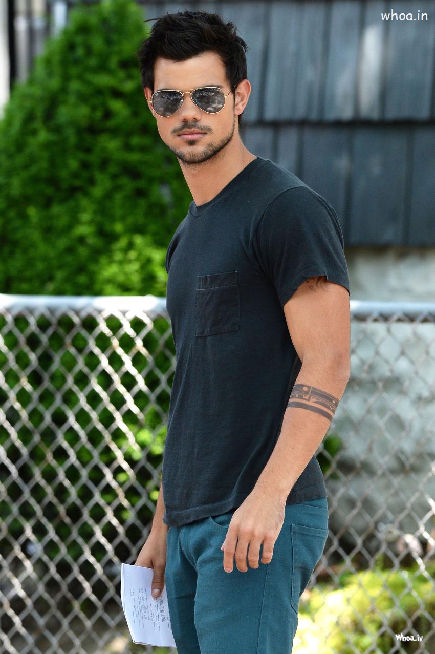 Taylor Lautner Black Sunglass With Natural Background