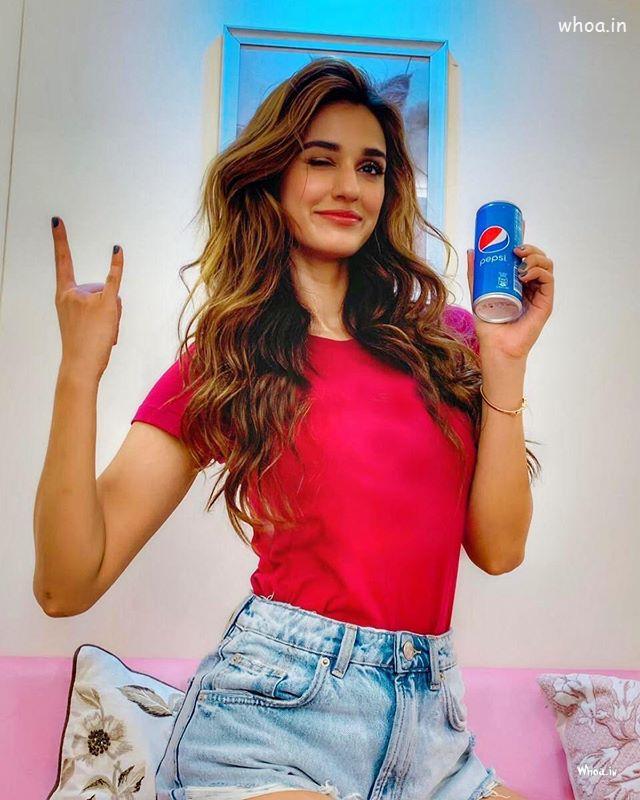 Disha Patani Wiht Pepsi Cold Drink Standing Pose Hd Image 