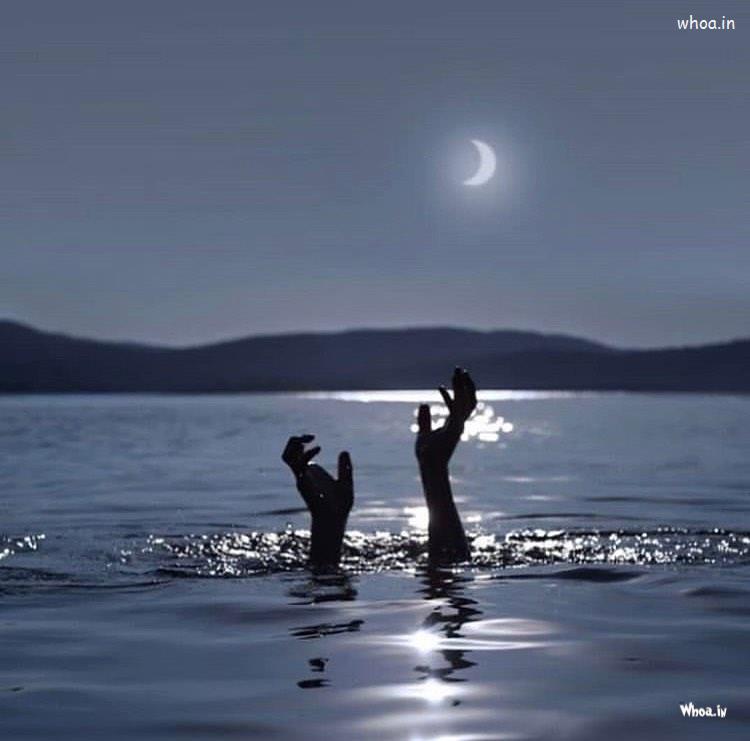 Man Trying To Save Himself In Water Night Scene Hd Image