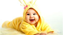 Smiley Cute Baby Boy Is Lying Down On Fur Cloth 