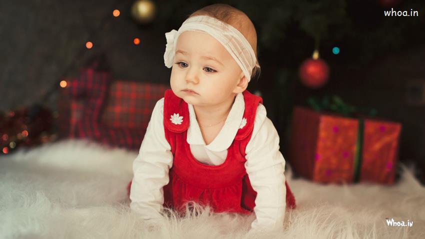 Cute Baby Girl Is Wearing Red White Dress In Blur Wallpaper
