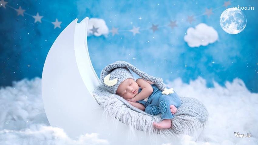 Very Cute Baby Child Is Wearing Blue Dress On Woolen Knitted